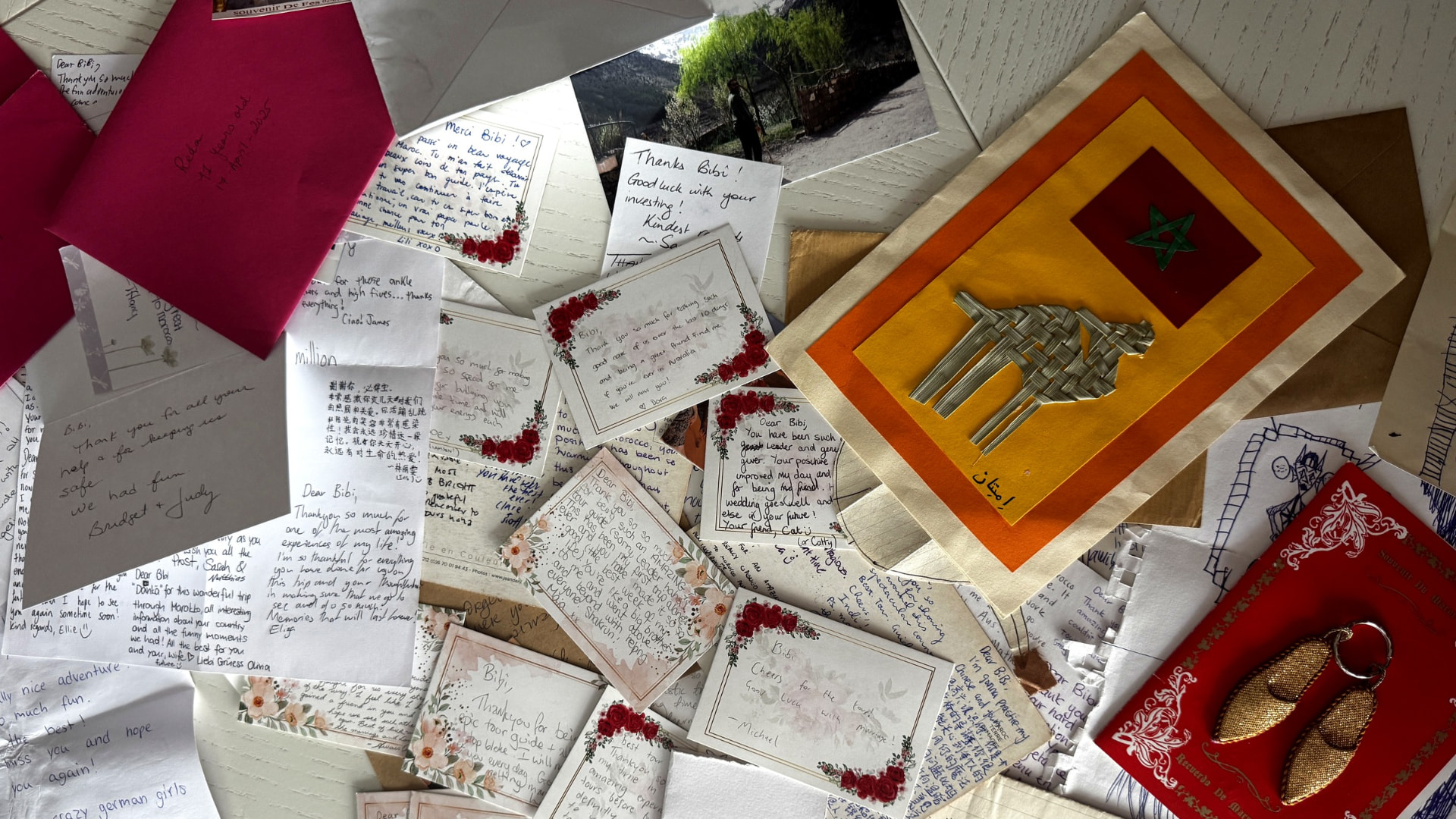A table covered with handwritten thank-you notes from guests.