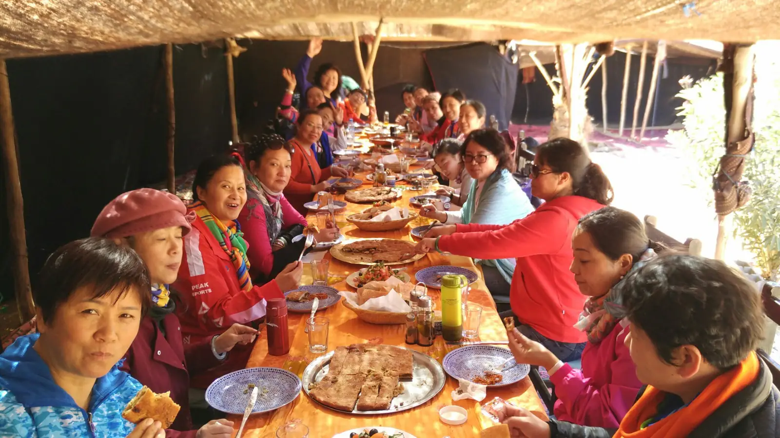 A private group sharing a meal during a tailor-made Morocco journey