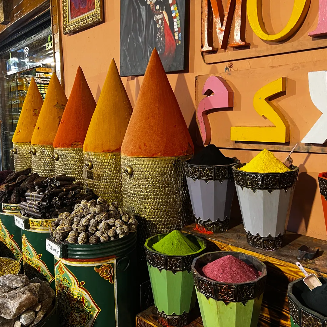 Spices displayed in open sacks at a Moroccan market
