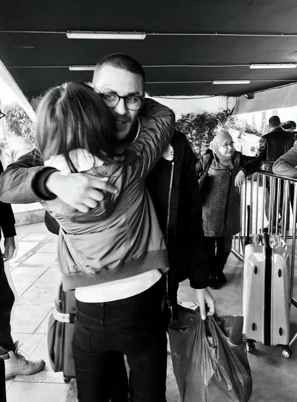 Reda saying goodbye to a guest after a tour